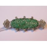 Art Deco oval carved jade and diamond set brooch, 7.8g, 51mm wide