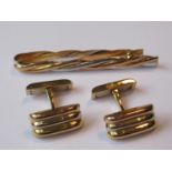 Pair of Cartier 18ct yellow gold cufflinks, together with a Cartier 18ct two colour gold tie clip,