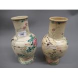 Pair of Japanese Satsuma pottery baluster form vases painted with birds in landscapes (at fault),