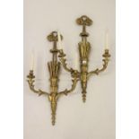 Pair of 19th Century carved and gilded twin light wall sconces, each with a bow surmount above a