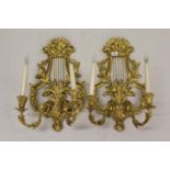 Pair of 19th Century carved and gilded lyre form twin light wall sconces, with mask head and
