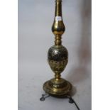 Large Middle Eastern brass table lamp with inlaid decoration, 33ins high together with an anodised
