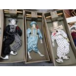 Group of five 20th Century puppets in the form of clowns, in original boxes, each approximately