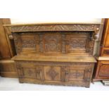 Titchmarsh & Goodwin, good quality reproduction carved oak court cupboard with carved frieze above