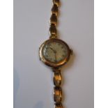 Ladies Rolex circular 9ct gold cased wristwatch with 9ct gold expanding strap