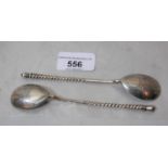 Pair of Russian silver spoons with twisted handles and engraved bowls