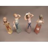 Set of four Lladro figures of girls wearing summer bonnets