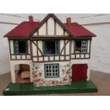 Mid 20th Century dolls house containing a quantity of various dolls house furniture