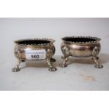Pair of George III silver open salts with gadroon rims on shell supports, maker R.H.