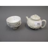 Antique Chinese blanc de chine miniature teapot with floral relief moulded decoration (cover