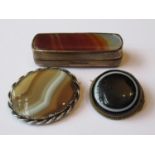 Two agate brooches and a small agate inset box