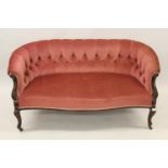 Small late 19th or early 20th Century carved mahogany and pink button upholstered two seat sofa