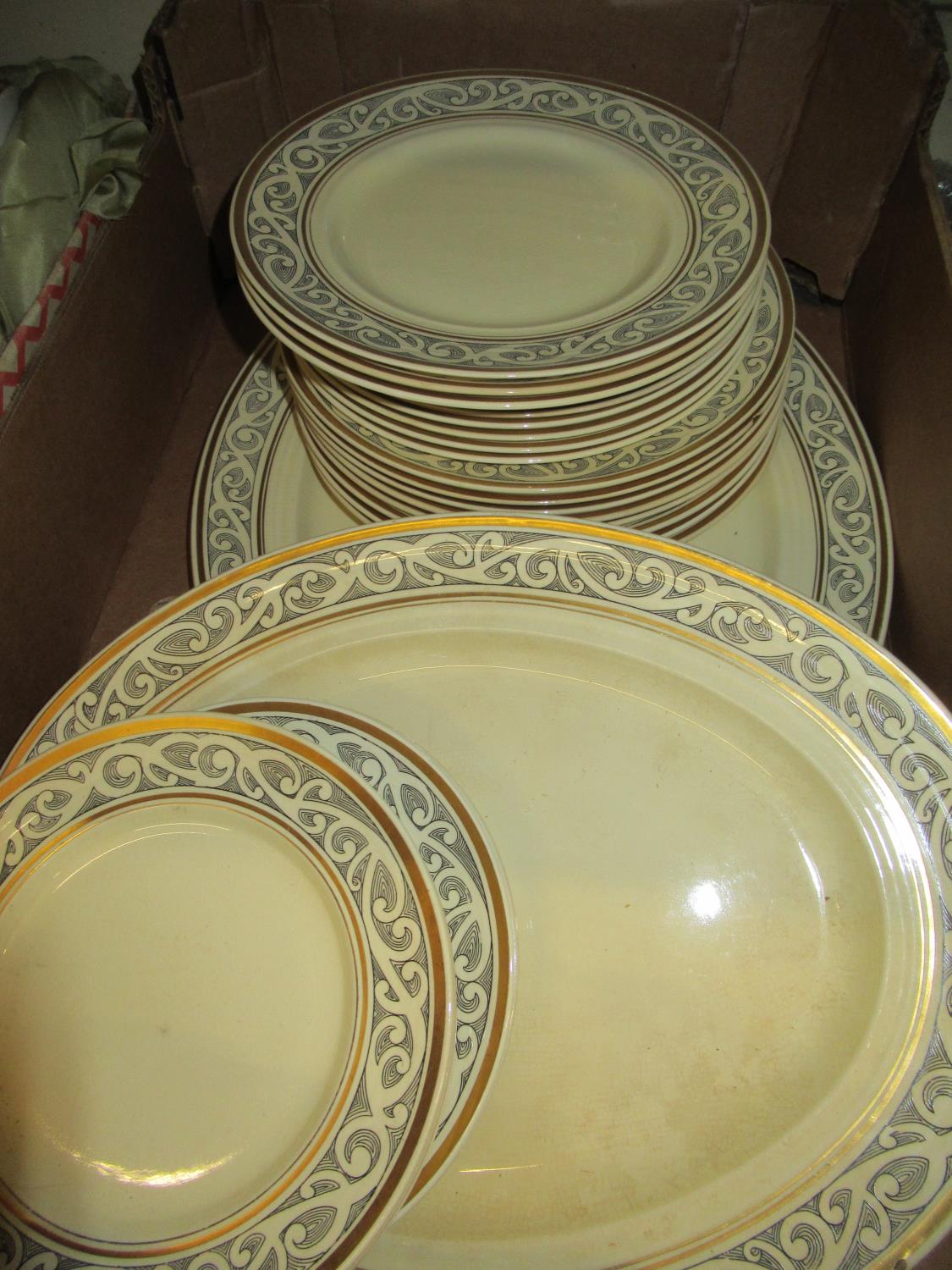 Booths Ribstone ware mid 20th Century part dinner service with black scroll decoration on a cream