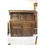 17th Century oak court cupboard, the carved frieze inscribed ' 1657 MR ', with two panel doors above