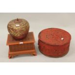 20th Century oriental circular red lacquer box and cover, 17.5ins diameter together with a similar