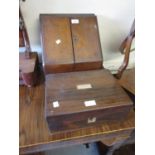 19th Century figured mahogany desktop stationery box, the hinged sloping doors enclosing a fitted