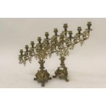 Pair of 19th Century gilt brass seven branch candle stands of pierced foliate design with C-scroll