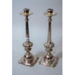 Pair of silver plated tapering and fluted column candlesticks, 12ins high