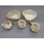 Belleek lattice work basket shaped dish (impressed mark), together with a similar heart shaped dish,