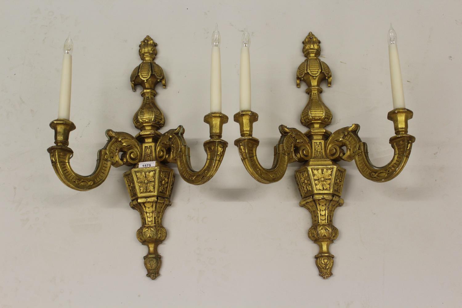 Pair of 19th Century carved and gilded composition twin light wall sconces of faceted baluster form,