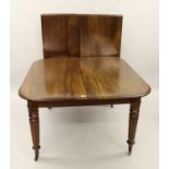 19th Century mahogany wind-out extending dining table having three extra leaves, the plain frieze