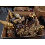 Collection of seven various large Burmese carved wooden puppets with sequin decorated costumes, each