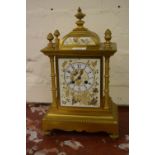 19th Century French ormolu mantel clock with porcelain dial and surmount, the two train movement