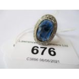 French platinum oval sapphire and diamond ring, circa 1920, the sapphire approximately 14mm x