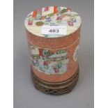 Chinese cylindrical box and cover decorated with panels of figures and flowers (small chips to rim),