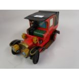 20th Century Japanese Alps tin plate battery operated early motor vehicle with driver (at fault),