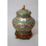20th Century cloisonne jar and cover decorated with a stylised floral design in shades of red, pink,