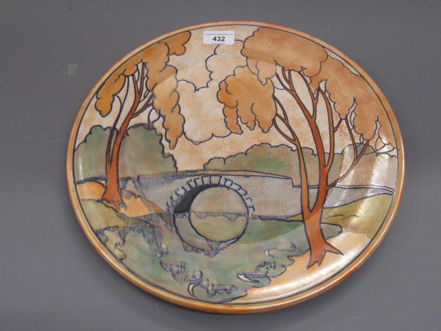 1930's Burgess and Leigh pottery charger, decorated with a tube lined design depicting a wooded