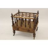Victorian walnut three division Canterbury with spindle turned uprights above a single drawer on