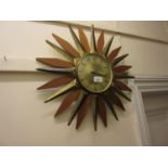 Mid Century teak and brass ' Starburst ' wall clock by Anstey and Wilson, England, 19ins diameter