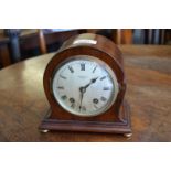 Edwardian mahogany dome shaped mantel clock having circular silvered dial with Roman numerals