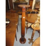 19th Century mahogany torchere with turned faceted carved column and turned base with low feet,