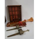 Pair of brass handled steel bladed daggers with brass sheaths, modern copper post horn, desk pen