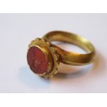 Roman high carat gold ring inset with a cornelian intaglio depicting a centaur, 7g (with