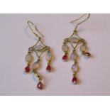 Pair of gold wirework drop earrings set opals and rubies, 3.4g