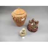 Pre-Columbian style figural candlestick together with a pottery vase and cover, 8ins high and a