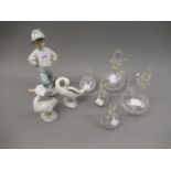 Lladro figure of a boy with a football, two Lladro figures of ducks and five various cut glass oil