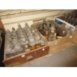 Three boxes containing a large quantity of glass apothecary bottles