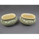 Pair of Zsolnay ovoid green glazed floral and foliate reticulated jardinieres, 60ins high, 9ins