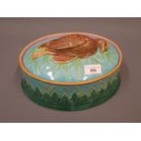 19th Century George Jones oval Majolica tureen and cover, the cover mounted with a figure of a
