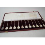 Cased set of twelve modern silver spoons in antique style, the terminals modelled in the form of