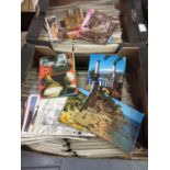 Four boxes containing a large quantity of mid 20th Century postcards