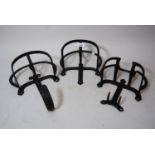 Three various black painted wrought iron tack racks