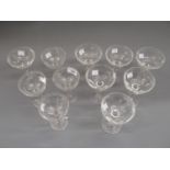 Set of seven 19th Century faceted glass Champagne cups (three with chips), together with four etched