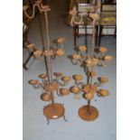 Pair of large iron tiered candelabra (at fault), 42ins high