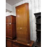 Heals oak standing corner cabinet, the moulded cornice above two panelled doors, 28ins x 62ins,